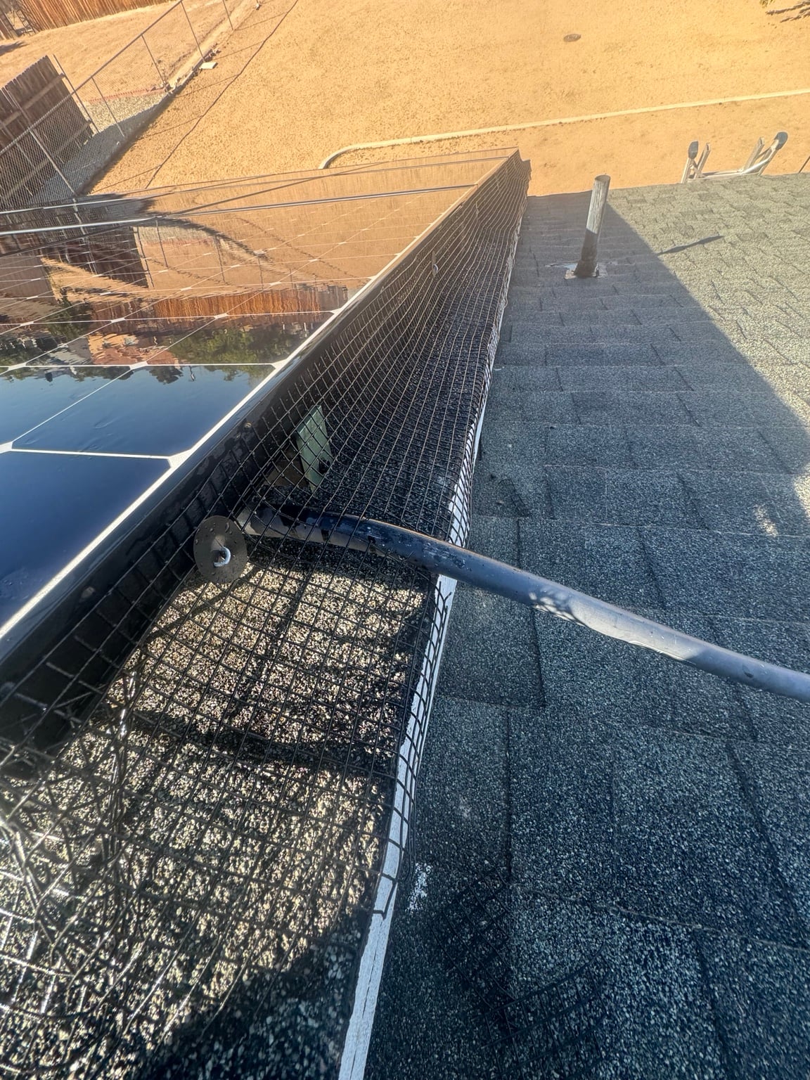 Bird proofing mesh installed around rooftop conduit